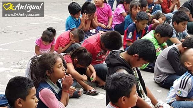 survivor children from Fuego's eruption praying